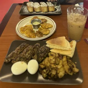 Steak and eggs, tostones, iced cafe con leche, and French toast
