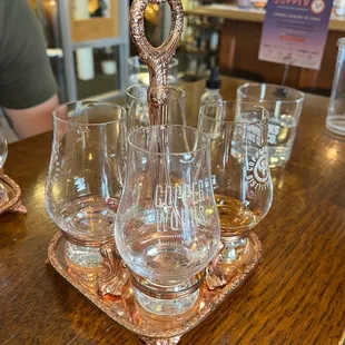 a tray of wine glasses