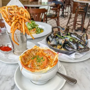 a bowl of pasta and a bowl of fries