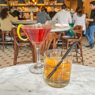 two cocktails on a table