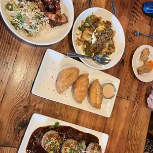 Rissotto cake, pork belly, chicken empanadas, chicken lumpia, Burratta Gallette.