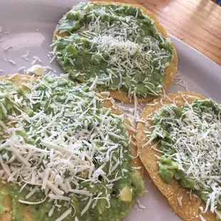 Tostadas with guacamole and cheese