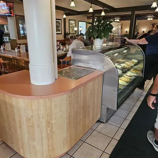 a woman standing in front of the counter