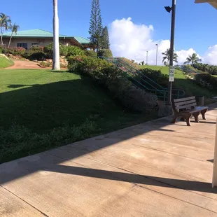Stairs at bottom of hill to driving range area