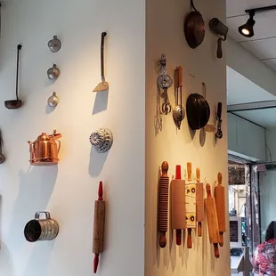 a wall of kitchen utensils