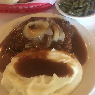 a plate of mashed potatoes and gravy