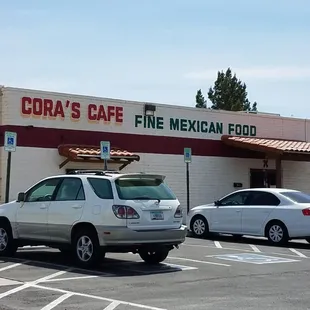 two cars parked in a parking lot