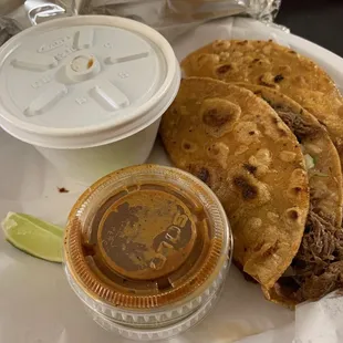 Birria Combo Tacos with Melted Cheese, Onion, Cilantro, Tomatillo Sauce, Radish, and a side of Lemon Birria Broth