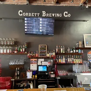 a bar with a menu on the wall