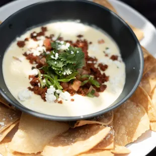 a bowl of soup and chips