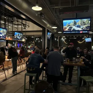 Bar and TVs nice heaters and fans outside seating