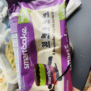 a hand holding a snack bag