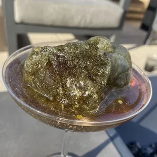 Fun cocktail with &quot;moon rock&quot; ice cube