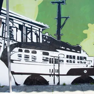 a mural of a man and a train