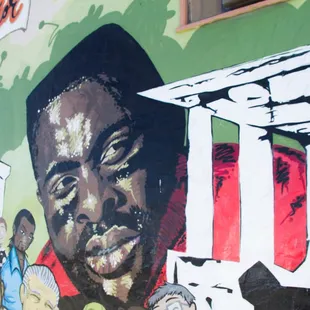 a mural of a man's face on the side of a building