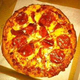 a pepperoni pizza in a box