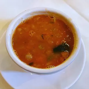 a bowl of soup on a plate