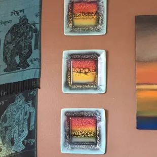 These 3 paintings are done on paper plates. They look like ceramic. Just beautiful.