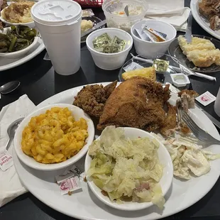 Fried chicken mac and cheese along with cabbage