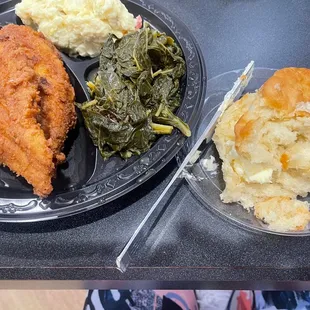 Fried catfish, collard greens, and potato salad along with a scrumptious biscuit