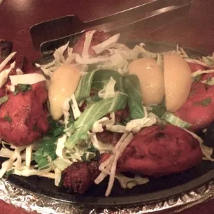 1/12/14... tandoori chicken cooked right. add tamarind sauce.  note: we remove meat from sizzling plate to prevent overcooking.