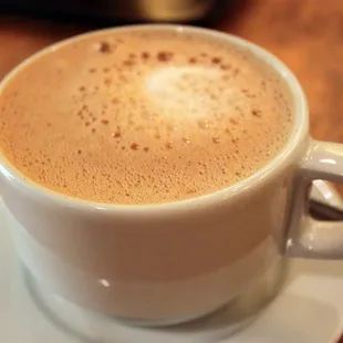 a cup of coffee on a saucer