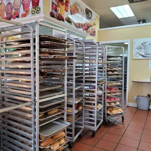a bakery with lots of trays of food