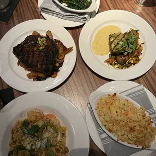 Broccolini (top), Wagyu ribeye (top left), grilled halibut (top right), spicy shrimp pasta (bottom left), Mac and cheese (bottom right)