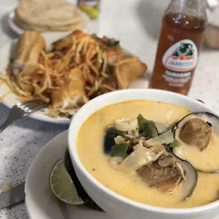 a bowl of soup and a plate of food