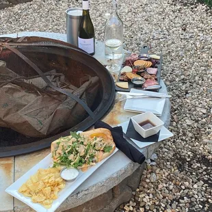 Wine, charcuterie, and a prime rib sandwich
