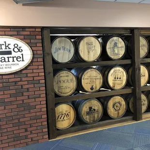 a wall of barrels in a wine cellar
