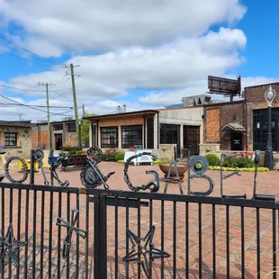 a bicycle parked in front of a brick building