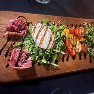 Close-Up Burrata! Served with Shaved Prosciutto &amp; Assorted Plum Tomatoes Topped EVOO &amp; Balsamic~