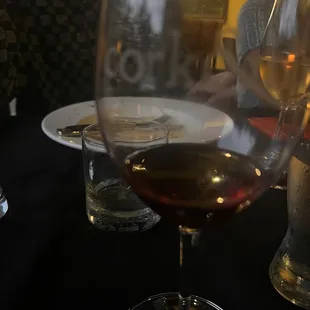 a glass of wine on a table