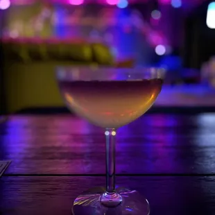 a glass of wine on a table