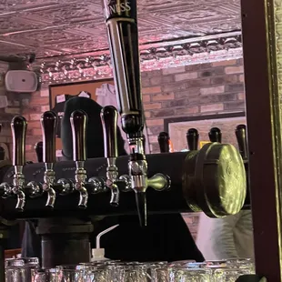 a row of beer taps