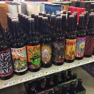 a variety of beer bottles on a shelf