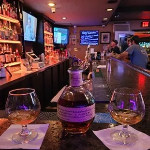 hree glasses of wine on a bar