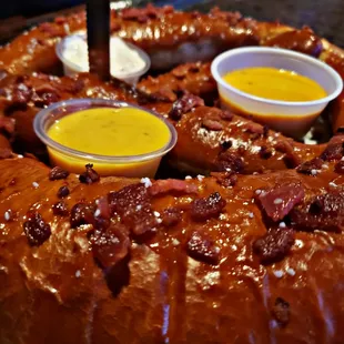 12" jumbo pretzel with smokey bacon bits with choice sides of beer cheese, garlic parmesan, honey mustard, jalapeno cheese