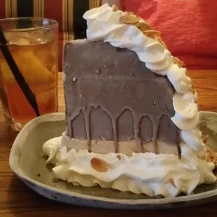 Decadent awesome Mud Pie dessert.  Ice cream and choc. cookie with chocolate shell, whipped cream, and slivered almonds.