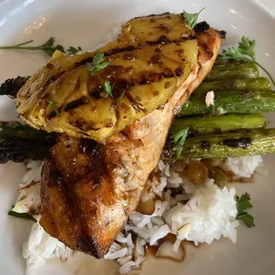 Grilled salmon, pineapple and asparagus on bed of rice with a teriyaki drizzle.  Absolutely delicious!