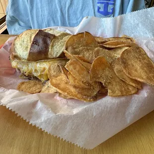 Grilled ham and cheese on a pretzel bun