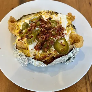 This is a fried fish baked potato! Impressive meal!