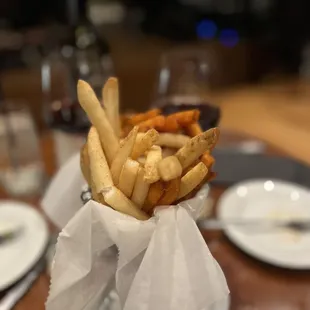 a basket of french fries on a table
