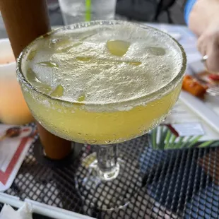 a margarita with a slice of pizza