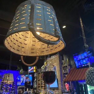 Hanging wine glasses from the chandelier
