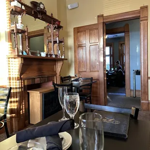 a dining room with a fireplace