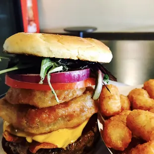 $10 Lunch special...D Burger... fresh made beef patties, BBQ, bacon, cheese, battered onion rings w/ fries plus a could beer