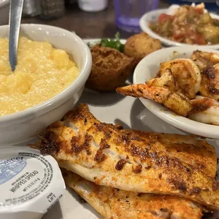 Blackened fish and shrimp lunch special. With cheese grits and okra and tomatoes. So good.