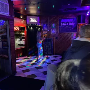 a woman walking through the doorway